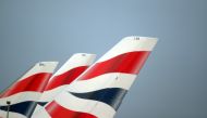 FILE PHOTO: British Airways logos are seen on tail fins at Heathrow Airport in west London, Britain, February 23, 2018. REUTERS/Hannah McKay