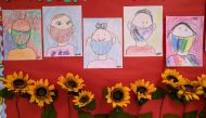 STAMFORD, CONNECTICUT - SEPTEMBER 16: Drawings of children wearing masks adorn a hallway at Stark Elementary School on September 16, 2020 in Stamford, Connecticut. John Moore/AFP