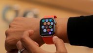FILE PHOTO: An Apple Store employee shows the new Series 5 Apple Watch during the preview of the redesigned and reimagined Apple Fifth Avenue store in New York, U.S., September 19, 2019. REUTERS/Brendan McDermid