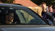 Supporters greet Real Madrid's Welsh midfielder Gareth Bale as he arrives at the Tottenham Hotspur training ground in north London on September 18, 2020. AFP / David MIRZOEFF