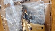 A handout photograph released by the Metropolitan Police in London on September 21, 2020, shows a yellow-handed Llama pistol, which featured in James Bond 007 movie 