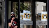 FILE PHOTO: A man wearing a face mask leaves a shopping mall as the spread of the coronavirus disease (COVID-19) continues in Prague, Czech Republic, September 14, 2020. REUTERS/David W Cerny/File Photo
