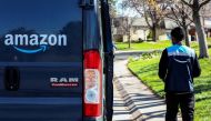 An Amazon worker delivers packages amid the coronavirus disease (COVID-19) outbreak in Denver, Colorado, U.S. Picture taken April 22, 2020. REUTERS/Kevin Mohatt/File Photo