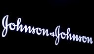 FILE PHOTO: The company logo for Johnson & Johnson is displayed on a screen to celebrate the 75th anniversary of the company's listing at the New York Stock Exchange (NYSE) in New York, U.S., September 17, 2019. REUTERS/Brendan McDermid/File Photo