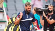 Benoit Paire of France leaves the court after he gave up in the second set his first round match against Casper Ruud of Norway during the ATP-Tour German Open tennis tournament at the stadium Am Rothenbaum in Hamburg, northern Germany, on September 23, 20