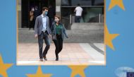 People wearing protective masks walk past the European Parliament headquarters amid the coronavirus disease (COVID-19) outbreak in Brussels, Belgium September 23, 2020. REUTERS/Yves Herman