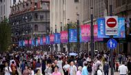 People visit a main shopping area following the coronavirus disease (COVID-19) outbreak in Shanghai, China September 24, 2020. REUTERS/Aly Song