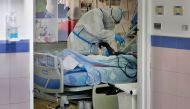 Medical staff work in the Covid-19 isolation ward / AFP / GIL COHEN-MAGEN
