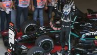 Mercedes' Finnish driver Valtteri Bottas celebrates after winning the Formula One Russian Grand Prix at the Sochi Autodrom Circuit in Sochi on September 27, 2020. / AFP / POOL / Kirill KUDRYAVTSEV