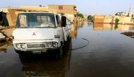 FILE PHOTO: A truck is seen in the waters of the Blue Nile floods within the Al-Ikmayr area of Omdurman in Khartoum, Sudan August 27, 2020. REUTERS/Mohamed Nureldin Abdallah