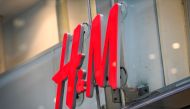 (FILES) This file photograph taken on April 2, 2020, shows the logo of H & M (Hennes & Mauritz AB) at a company store in central Stockholm. AFP / TT News Agency / Fredrik Sandberg 