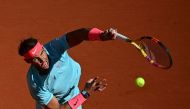 Spain's Rafael Nadal serves the ball to Sebastian Korda of the US during their men's singles fourth round tennis match on Day 8 of The Roland Garros 2020 French Open tennis tournament in Paris on October 4, 2020. / AFP / MARTIN BUREAU
