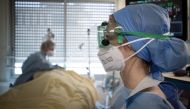 (FILES) In this file photo taken on April 27, 2020 Medical workers tend to a patient infected with COVID-19 at the intensive care unit of the Lariboisiere Hospital of the AP-HP (Assistance Publique - Hopitaux de Paris) in Paris. AFP / JOEL SAGET