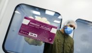 File photo: A lab technician shows the coronavirus disease (COVID-19) treatment drug 