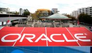 COMBO) This combination of file pictures created on October 2, 2020 shows the Oracle logo (top) at the Oracle OpenWorld 2011 in San Francisco; and a Google logo at the Googleplex in Menlo Park, California on November 4, 2016.. / AFP / KIMIHIRO HOSHINO AND