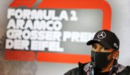This handout photo taken and released on October 8, 2020 by the International Automobile Federation (FIA) shows Mercedes' British driver Lewis Hamilton during the drivers' press conference for the Formula One Eifel Grand Prix at the Nuerburgring circuit i