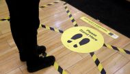 Social distancing markers as a preventive measure against the spread of the coronavirus disease (COVID-19) are seen at a Dunnes Stores shop in Belfast, Northern Ireland, May 6, 2020. Picture taken May 6, 2020. REUTERS/Jason Cairnduff/File Photo
