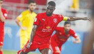 Al Duhail's captain Almoez Ali shoots to score against Qatar SC during yesterday's match. 