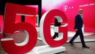 File photo: Tim Hoettges, CEO of Deutsche Telekom AG, walks on stage past a 5G technology setup during the company's annual shareholder meeting in Bonn, Germany, March 28, 2019. Reuters/Wolfgang Rattay/File Photo