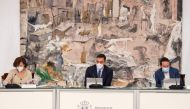 A handout picture released by the Moncloa Palace shows (L-R) Spain's Deputy Prime Minister and Minister of Presidency and Relations with Parliament Carmen Calvo, Spain's Prime Minister Pedro Sanchez and Spain's Deputy Prime Minister for Social Rights and 