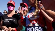 FILE PHOTO: A supporter holds up four fingers during U.S. President Donald Trump's campaign rally at Laughlin/Bullhead International Airport in Bullhead City, Arizona, U.S., October 28, 2020. REUTERS/Jonathan Ernst/File Photo
