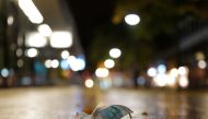 A used protective mask is left in an pedestrian area as the spread of COVID-19 continues in Frankfurt, Germany, November 1, 2020, REUTERS/Kai Pfaffenbach