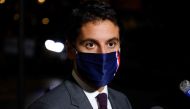 French Secretary of State and Government's spokesperson Gabriel Attal answers to media after an information meeting chaired by the French Prime minister with political party chiefs on October 27, 2020, in Paris, ahead of the probable announcement of tough