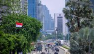 Light traffic along the main road in central Jakarta after months of the government's policy implementing work from home. / AFP / BAY ISMOYO