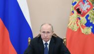 Russian President Vladimir Putin attends a meeting with the members of the Security Council via teleconference call, in Moscow, Russia on November 6, 2020. / AFP / Sputnik / Alexey NIKOLSKY