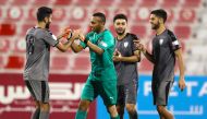 Al Wakrah's goalkeeper Saoud Mubarak Al Khater (second left) celebrates with team-mates after a blocking a penalty during yesterday's quarter-final. 