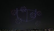 FILE PHOTO: Drones fly over the Han river showing messages to support the country, as measures to avoid the spread of the coronavirus continue, in Seoul, South Korea. Yonhap via REUTERS

