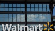 In this file photo taken on August 18, 2020 a Walmart logo is seen outside a store in Washington, DC. Walmart reported another strong quarter on November 17, 2020, pivoting during the coronavirus pandemic, with more consumers shifting to e-commerce and sh