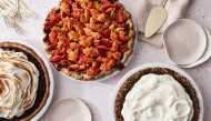 From left: Roasted Cranberry with Meringue topping in Press in Cookie Crust; Caramel Apple Pie With an All-Butter Crust and Painted Cutout Topping; Fall-Spice Pudding Pie with Whipped Cream and a Nut Crust. Photo by Mark Weinberg for The Washington Post.