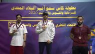 The podium winners of the 10m Air Pistol event, Ahmed Al Shammari (gold), Ali Hassan (silver) and Osama Al Shaiba (bronze), posing for a photograph at the Lusail Complex yesterday.