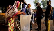 A woman casts her vote at a polling station during the presidential and legislative election in Ouagadougou, Burkina Faso, November 22, 2020. REUTERS/Zohra Bensemra