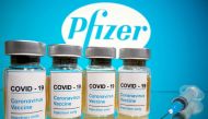 FILE PHOTO: FILE PHOTO: FILE PHOTO: FILE PHOTO: Vials with a sticker reading, 