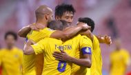 Al Gharafa players celebrate.