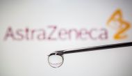 FILE PHOTO: AstraZeneca's logo is reflected in a drop on a syringe needle in this illustration taken November 9, 2020. REUTERS/Dado Ruvic/Illustration
