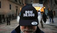 Trader Peter Tuchman wears a DOW 30,000 hat as he greets friends outside the New York Stock Exchange (NYSE) in New York, U.S., November 24, 2020. REUTERS/Brendan McDermid