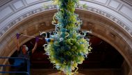 File photo: A museum technician cleans the V&A Rotunda Chandelier by Dale Chihuly during preparations to reopen the Victoria & Albert (V&A) Museum, after the outbreak of the coronavirus disease (COVID-19) caused its closure, in London, Britain, August 4, 