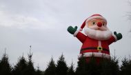 An inflatable Santa Claus doll is pictured at a christmas Tree Farm, amidst the outbreak of the coronavirus disease (COVID-19), in Keele, Staffordshire, Britain November 24, 2020. REUTERS/Carl Recine
