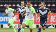 Beijing’s Jonathan Viera (centre) is marked by Melbourne’s midfielder Leigh Broxham (right) during their AFC Champions League group E match yesterday. 