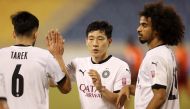 Al Sadd's Akram Afif (right) celebrates a goal with team-mates during QSL match against Umm Salal, yesterday. 