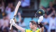 Australia’s Steve Smith celebrates reaching his century during the one-day international cricket match against India at the Sydney Cricket Ground (SCG) in Sydney on November 27, 2020. AFP / David Gray 