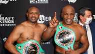 This handout images courtesy of Getty Images for Triller shows Roy Jones Jr. (L) and Mike Tyson celebrate their split draw during Mike Tyson vs Roy Jones Jr. presented by Triller at Staples Center on November 28, 2020 in Los Angeles, California. AFP PHOTO