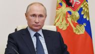 Russian President Vladimir Putin attends a ceremony to launch a new pharmaceutical substance large-scale production department at the Bratskkhimsintez plant of Russian drugmaker Pharmasyntez, via video link at Novo-Ogaryovo state residence, outside Moscow