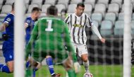 Juventus' Portuguese forward Cristiano Ronaldo (R) outruns Dynamo Kiev's Polish defender Tomasz Kedziora (L) and Dynamo Kiev's Ukrainian defender Denys Popov during the UEFA Champions League Group G football match Juventus vs Dynamo Kiev on December 2, 20