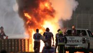 Flames seen from the crash scene after Haas' Romain Grosjean crashed out at the start of the race Pool via REUTERS/Kamran Jebreili/File Photo