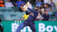 India's Ravindra Jadeja hits a boundary during the T20 cricket match between India and Australia at Manuka Oval in Canberra on December 4, 2020. (AFP / DAVID GRAY)