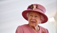 Britain's Queen Elizabeth speaks with staff during a visit to the Defence Science and Technology Laboratory at Porton Science Park near Salisbury, Britain October 15, 2020. Ben Stansall/Pool via REUTERS/File Photo